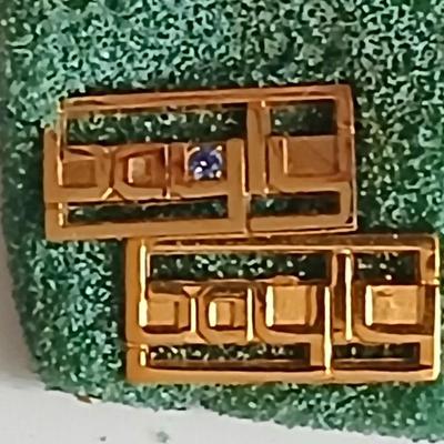 Assortment of award pins with a black fabric covered box