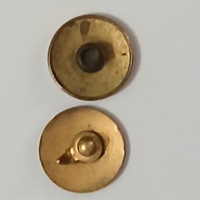 Assortment of award pins with a black fabric covered box
