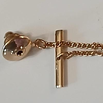 Assortment of award pins with a black fabric covered box