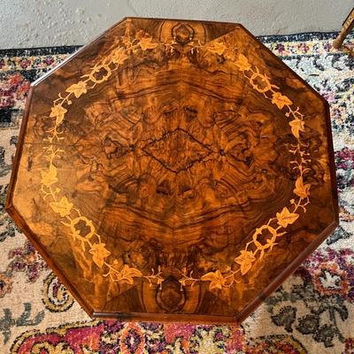 Sale Photo Thumbnail #151: Octagonal Table crafted from Walnut and Burr Walnut featuring exquisite marquetry inlay
29" Wide X 19.5" Tall