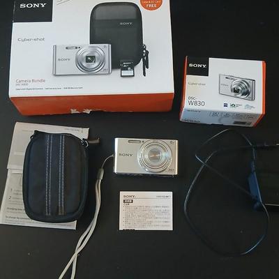 Sony Cybershot digital camera DSC-W830 with charger, case, and original packaging