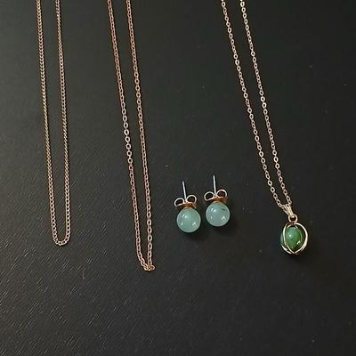 Gold toned jewelry with stones - necklace - and earrings with two additional gold toned chains