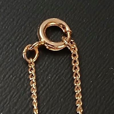 Gold toned jewelry with stones - necklace - and earrings with two additional gold toned chains