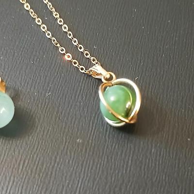 Gold toned jewelry with stones - necklace - and earrings with two additional gold toned chains