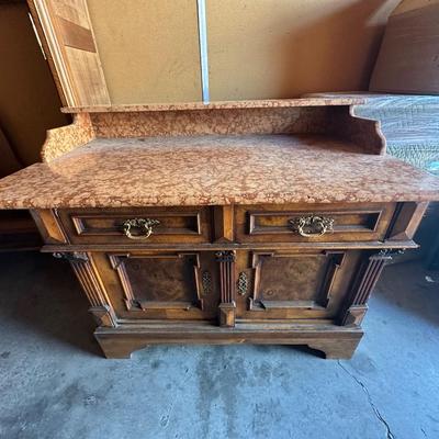 Sale Photo Thumbnail #5: French Louis XV Dry Sink with Pink Marble
Handsome marble-top dry sink / dresser-cabinet in the Louis XV style, featuring a pink marble surface and graceful lines. The matching mirror is included (not pictured in the current photos).
Dimensions (approx.):