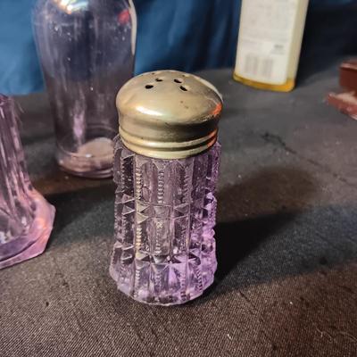 ANTIQUE GLASS PIECES WITH A PURPLE HUE