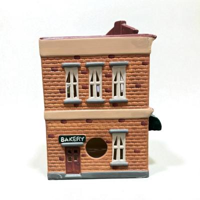 Sale Photo Thumbnail #302: Dept 56 Original Snow Village Bakery 5077-6.  Includes Box, Styrofoam Packer, Light Cord.  Excellent condition, no chips or scratches
Approximately 8.5" H X 6.5" W