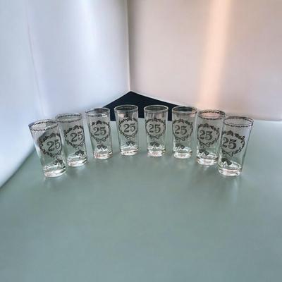 Sale Photo Thumbnail #348: Vintage Culver 25th Anniversary Glasses Set of 8.  These glasses, typically highball or tumbler style, feature decorative silver overlay patterns commemorating a 25th anniversary.  No Chips