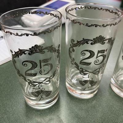 Sale Photo Thumbnail #343: Vintage Culver 25th Anniversary Glasses Set of 8.  These glasses, typically highball or tumbler style, feature decorative silver overlay patterns commemorating a 25th anniversary.  No Chips