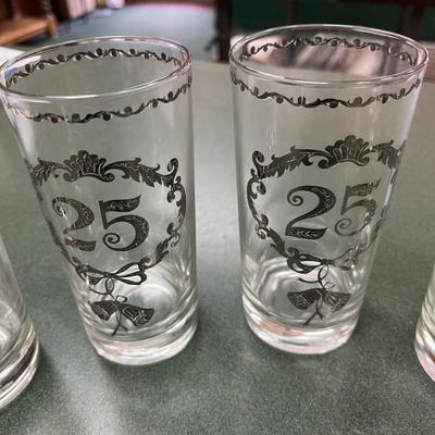 Sale Photo Thumbnail #344: Vintage Culver 25th Anniversary Glasses Set of 8.  These glasses, typically highball or tumbler style, feature decorative silver overlay patterns commemorating a 25th anniversary.  No Chips