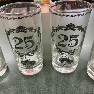 Sale Photo Thumbnail #345: Vintage Culver 25th Anniversary Glasses Set of 8.  These glasses, typically highball or tumbler style, feature decorative silver overlay patterns commemorating a 25th anniversary.  No Chips