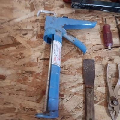 AN ASSORTMENT OF HAND TOOLS AND A POWER STAPLER