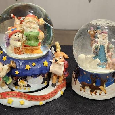 Sale Photo Thumbnail #185: Vintage Snowglobes with Santa & Reindeer " We wish you a Merry Christmas".
Receive both items pictured and are in great condition