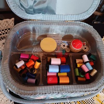 SEWING BASKET W/NOTIONS AND SEVERAL DOILIES