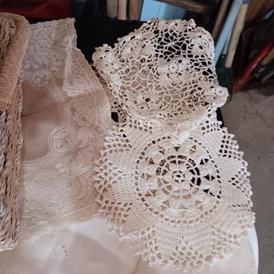 SEWING BASKET W/NOTIONS AND A VARIETY OF DOILIES
