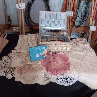 SEWING BASKET W/NOTIONS AND A VARIETY OF DOILIES