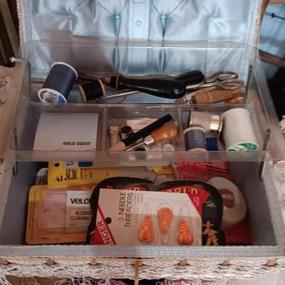SEWING BASKET W/NOTIONS AND A VARIETY OF DOILIES