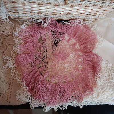 SEWING BASKET W/NOTIONS AND A VARIETY OF DOILIES
