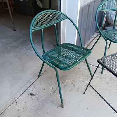2 FOLDING METAL MESH CHAIRS AND A METAL TABLE