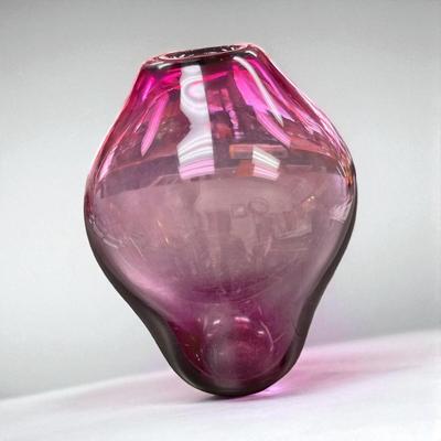 Sale Photo Thumbnail #494: Vintage Cranberry Hand Blown Glass Vase.  It appear to be an MCM Or Art Deco Inspired Design.
6.5" at the widest point.   4" at the base  Note small marks on the top.