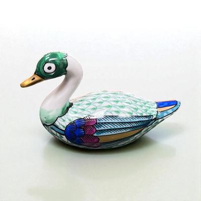 Sale Photo Thumbnail #500: Manifattura Artistica Le Porcellane Swan Figurine from Italy.  These ceramic figurines often featur vibrant colors and intricate details like the fishnet pattern seen on the body of the swan.