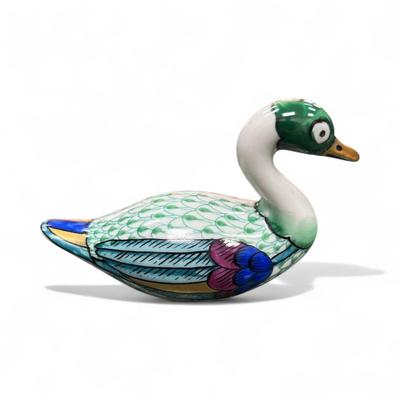 Sale Photo Thumbnail #499: Manifattura Artistica Le Porcellane Swan Figurine from Italy.  These ceramic figurines often featur vibrant colors and intricate details like the fishnet pattern seen on the body of the swan.