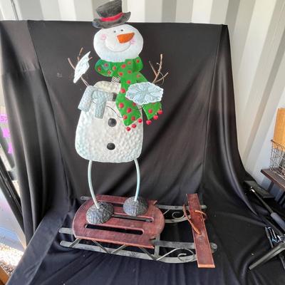 Lot 56 Metal Snow man & decorative sleigh.