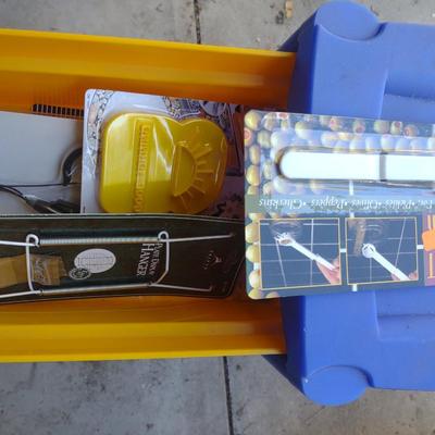 COLORFUL PLASTIC DRAWERS FILLED WITH HOUSEHOLD ITEMS