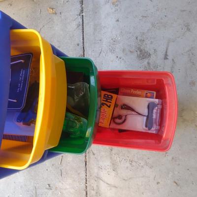 COLORFUL PLASTIC DRAWERS FILLED WITH HOUSEHOLD ITEMS