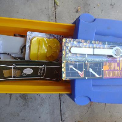 COLORFUL PLASTIC DRAWERS FILLED WITH HOUSEHOLD ITEMS