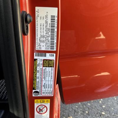 Sale Photo Thumbnail #14: 2023 Toyota Tacoma TRD Off-Road – Rugged, reliable, and adventure-ready! This eye-catching red Tacoma comes with off-road wheels, all-terrain tires, and Toyota’s proven TRD Off-Road package. It has some light cosmetic wear (clear coat on mirrors and a