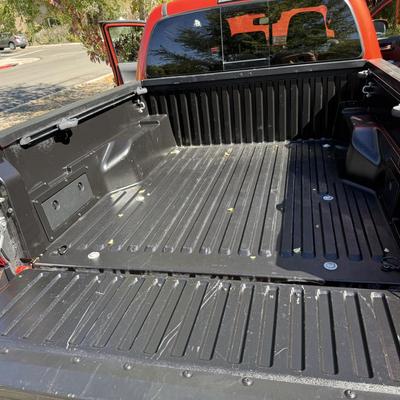 Sale Photo Thumbnail #19: 2023 Toyota Tacoma TRD Off-Road – Rugged, reliable, and adventure-ready! This eye-catching red Tacoma comes with off-road wheels, all-terrain tires, and Toyota’s proven TRD Off-Road package. It has some light cosmetic wear (clear coat on mirrors and a
