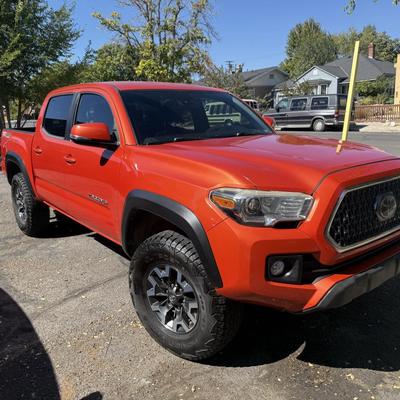 Sale Photo Thumbnail #1: 2023 Toyota Tacoma TRD Off-Road – Rugged, reliable, and adventure-ready! This eye-catching red Tacoma comes with off-road wheels, all-terrain tires, and Toyota’s proven TRD Off-Road package. It has some light cosmetic wear (clear coat on mirrors and a