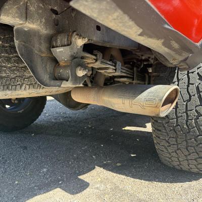 Sale Photo Thumbnail #10: 2023 Toyota Tacoma TRD Off-Road – Rugged, reliable, and adventure-ready! This eye-catching red Tacoma comes with off-road wheels, all-terrain tires, and Toyota’s proven TRD Off-Road package. It has some light cosmetic wear (clear coat on mirrors and a