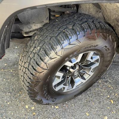 Sale Photo Thumbnail #15: 2023 Toyota Tacoma TRD Off-Road – Rugged, reliable, and adventure-ready! This eye-catching red Tacoma comes with off-road wheels, all-terrain tires, and Toyota’s proven TRD Off-Road package. It has some light cosmetic wear (clear coat on mirrors and a