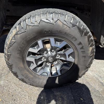 Sale Photo Thumbnail #17: 2023 Toyota Tacoma TRD Off-Road – Rugged, reliable, and adventure-ready! This eye-catching red Tacoma comes with off-road wheels, all-terrain tires, and Toyota’s proven TRD Off-Road package. It has some light cosmetic wear (clear coat on mirrors and a