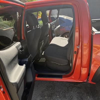 Sale Photo Thumbnail #8: 2023 Toyota Tacoma TRD Off-Road – Rugged, reliable, and adventure-ready! This eye-catching red Tacoma comes with off-road wheels, all-terrain tires, and Toyota’s proven TRD Off-Road package. It has some light cosmetic wear (clear coat on mirrors and a