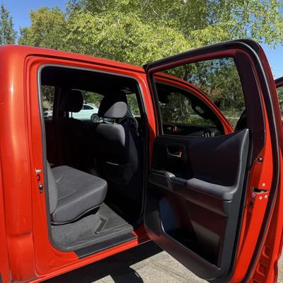 Sale Photo Thumbnail #7: 2023 Toyota Tacoma TRD Off-Road – Rugged, reliable, and adventure-ready! This eye-catching red Tacoma comes with off-road wheels, all-terrain tires, and Toyota’s proven TRD Off-Road package. It has some light cosmetic wear (clear coat on mirrors and a