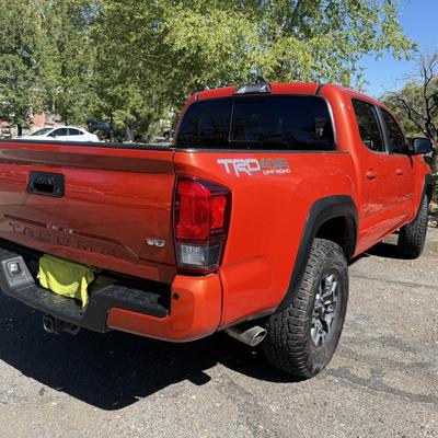 Sale Photo Thumbnail #5: 2023 Toyota Tacoma TRD Off-Road – Rugged, reliable, and adventure-ready! This eye-catching red Tacoma comes with off-road wheels, all-terrain tires, and Toyota’s proven TRD Off-Road package. It has some light cosmetic wear (clear coat on mirrors and a