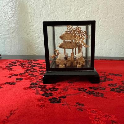 Sale Photo Thumbnail #24: Handcrafted scene with temple and cranes inside a glass display case.