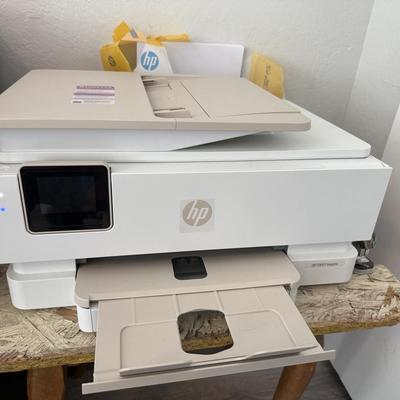 Sale Photo Thumbnail #28: All-in-one HP printer/copier/scanner, modern white design.
Pretty much new