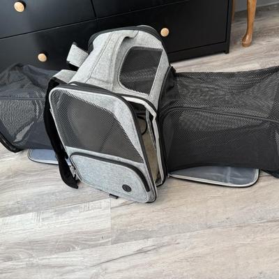Sale Photo Thumbnail #29: Gray and black soft-sided pet carrier with zip-out mesh extensions.
Looks new