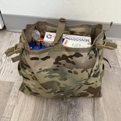 Sale Photo Thumbnail #38: Heavy-duty AKmax Outdoor rucksack system in multicam pattern with multiple attachments. Includes large framed rucksack, hydration carrier, detachable utility pouch, padded hip belt, and additional modular pieces. Built for rugged use, camping, hiking, or 