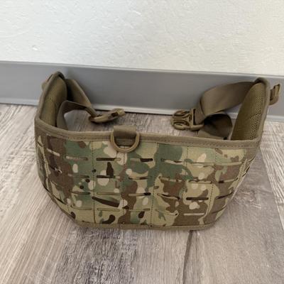 Sale Photo Thumbnail #37: Heavy-duty AKmax Outdoor rucksack system in multicam pattern with multiple attachments. Includes large framed rucksack, hydration carrier, detachable utility pouch, padded hip belt, and additional modular pieces. Built for rugged use, camping, hiking, or 