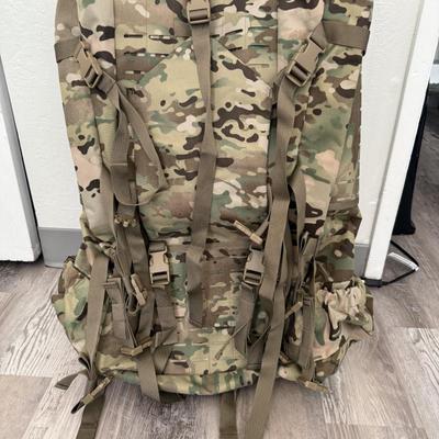 Sale Photo Thumbnail #32: Heavy-duty AKmax Outdoor rucksack system in multicam pattern with multiple attachments. Includes large framed rucksack, hydration carrier, detachable utility pouch, padded hip belt, and additional modular pieces. Built for rugged use, camping, hiking, or 