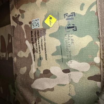 Sale Photo Thumbnail #33: Heavy-duty AKmax Outdoor rucksack system in multicam pattern with multiple attachments. Includes large framed rucksack, hydration carrier, detachable utility pouch, padded hip belt, and additional modular pieces. Built for rugged use, camping, hiking, or 