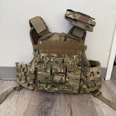 Sale Photo Thumbnail #39: Durable Condor Outdoor tactical vest in multicam camo pattern. Features multiple front magazine/utility pouches, padded shoulder straps, adjustable fit, and breathable mesh lining for comfort