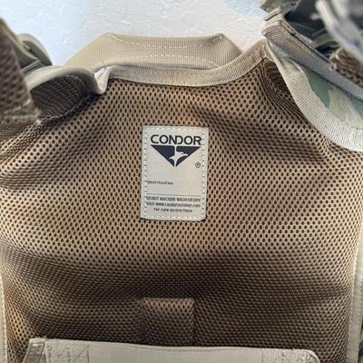 Sale Photo Thumbnail #40: Durable Condor Outdoor tactical vest in multicam camo pattern. Features multiple front magazine/utility pouches, padded shoulder straps, adjustable fit, and breathable mesh lining for comfort