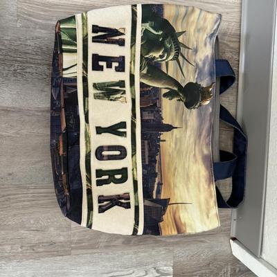 Sale Photo Thumbnail #43: Canvas tote featuring the Statue of Liberty and NYC skyline print, roomy for everyday carry.