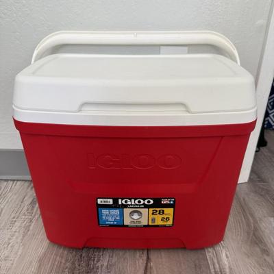 Sale Photo Thumbnail #52: Classic red and white hard cooler with carry handle, perfect for keeping food and drinks cold.